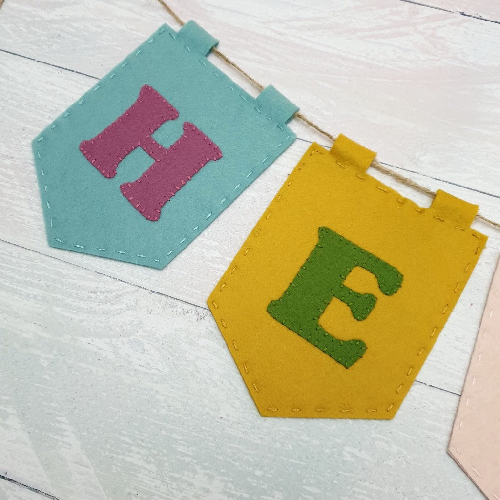 Close up view of hand sewn felt letters