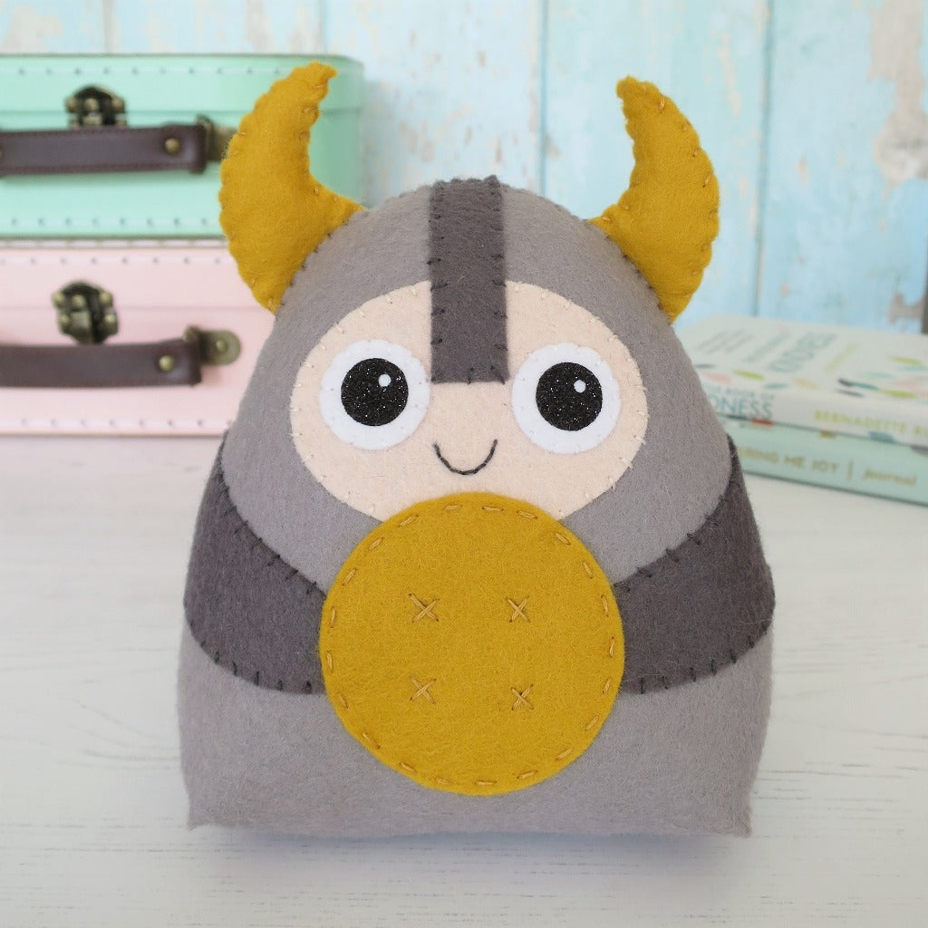 adorable felt viking character with horns and shield