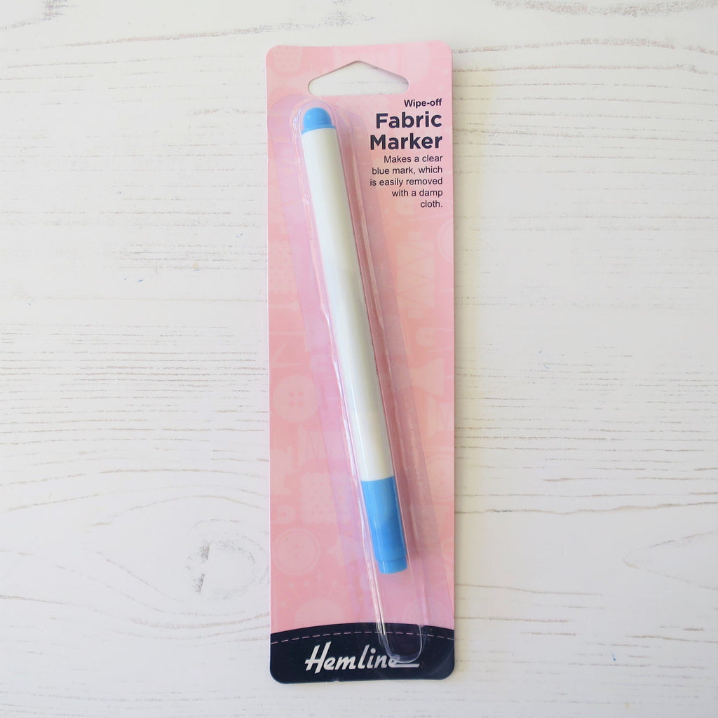 A fabric marker with blue tips, in pink Hemline packaging.