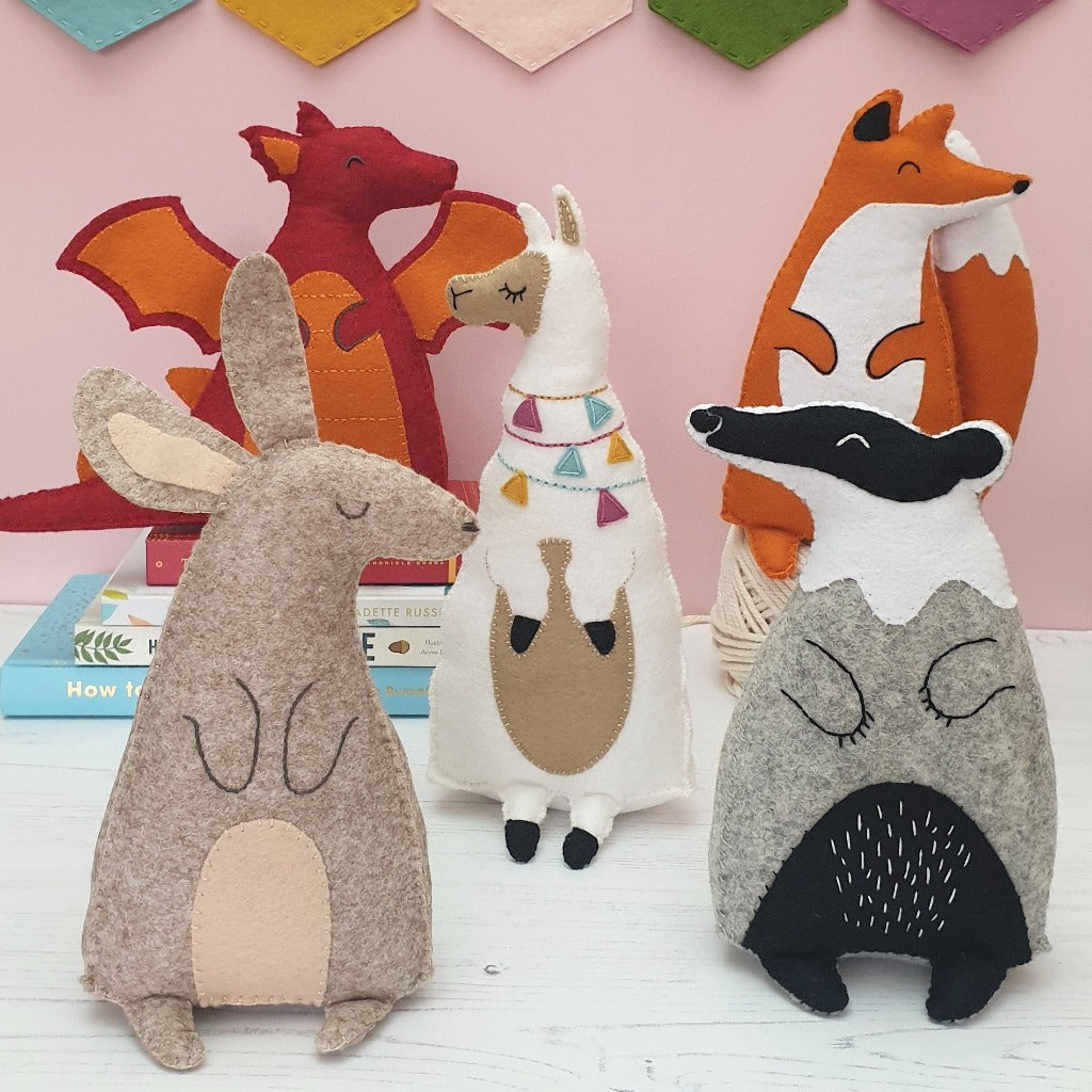 a collection of hand sewn felt animals